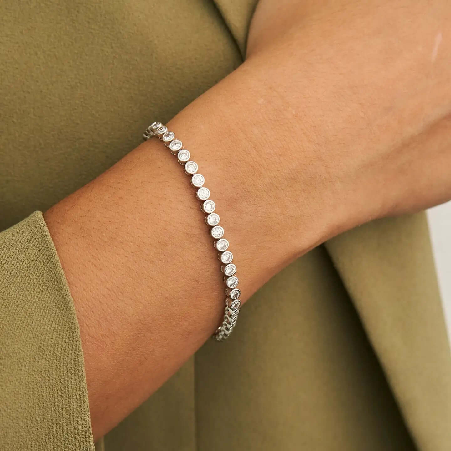 Stylish Silver Diamond Tennis Bracelet Links elegantly worn on a wrist, showcasing sparkling diamonds in premium silver.
